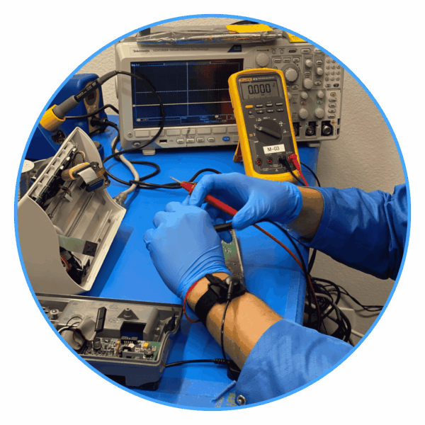 IPR Medical technician testing veterinary equipment at the repair bench